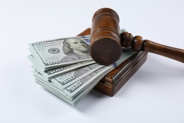 Judge's gavel and money on white background