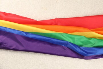 Rainbow LGBT flag on white background, closeup
