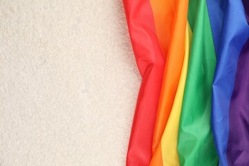 Rainbow LGBT flag on white background, top view. Space for text