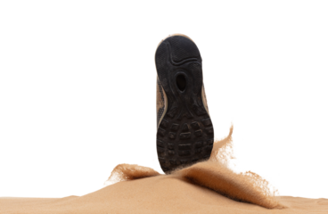 Unemployed Tired or stressed businessman kicking sand ground on walkway after work stressed. Back shoe foot step hit sand dust splashing over white background isolated