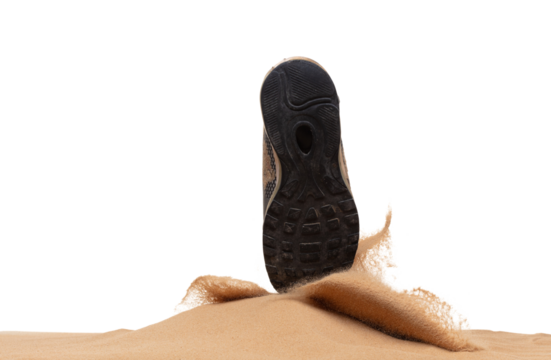 Unemployed Tired or stressed businessman kicking sand ground on walkway after work stressed. Back shoe foot step hit sand dust splashing over white background isolated