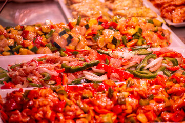Meat with vegetables, prepared for cooking in central market in Valencia, Spain