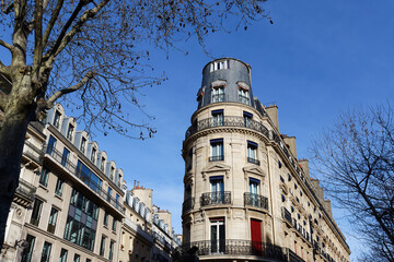 The facade of traditional French house with typical balconies and windows. Paris. - 752606093