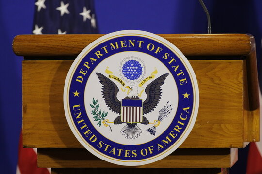 United States of America Department of State logo and flag on stage for press conference announcement - Rio de Janeiro, Brazil 02.22.2024