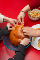 Children nibbling on fresh bread. Family time. Sharing food. Love. 