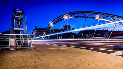 Modern bridge at dusk with glowing traces of light from passing vehicles, Luitpoldbruecke Bamberg