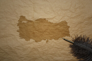 map of turkey on a old paper background with old pen - obrazy, fototapety, plakaty