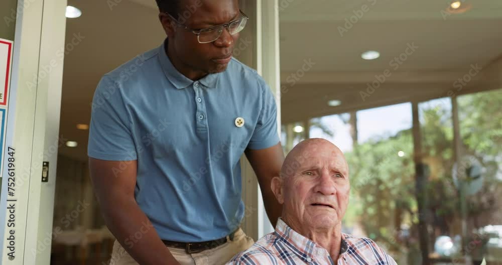 Wall mural Wheelchair, senior man and caregiver with support, healthcare and volunteer work at a hospital. Rehabilitation, medic and retirement home with person with disability and nurse at clinic for wellness