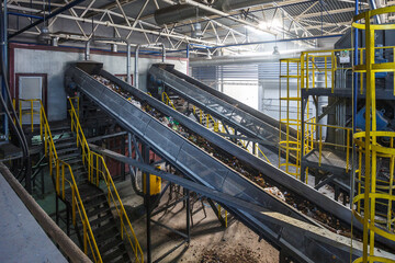 moving conveyor transporter on Modern waste recycling processing plant. Separate and sorting...
