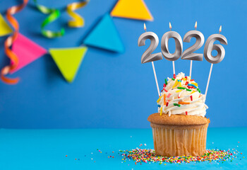 Happy New Year 2026 - Candles in the form of burning numbers on a blue background