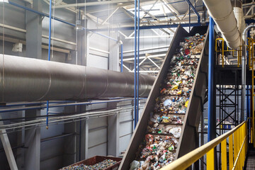 moving conveyor transporter on Modern waste recycling processing plant. Separate and sorting garbage collection. Recycling and storage of waste for further disposal. - obrazy, fototapety, plakaty