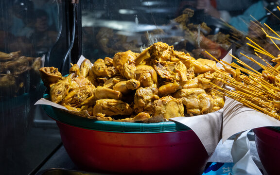 Street food at night. Selling Fried Chicken, Fried Tofu, Fried Tempeh and Petai at Indonesia.