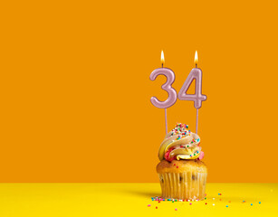 Birthday celebration with cupcake - Candle number 34