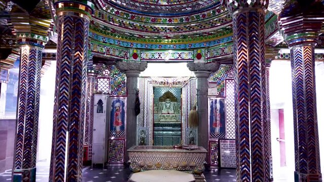  Udaipur, Rajasthan, India-October 30 2023; Exquisite Interiors of a Jain temple decorated with colorful Mirrors and glass dedicated to Lord Mahavira and Parasnath at Udaipur in Rajasthan, India.
