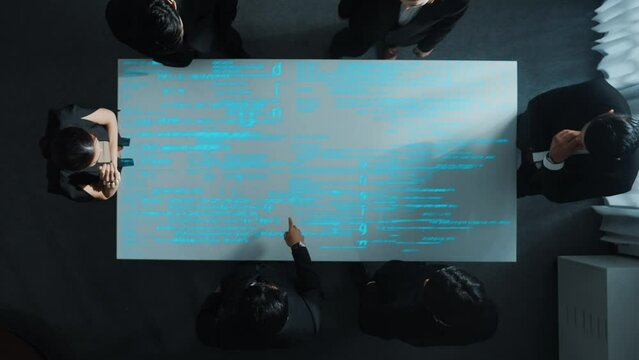 Top down aerial view of diverse businessman discussing about coding engineering prompt. Skilled diverse business group brainstorming idea about programing code and software development. Directorate.