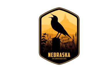 Nebraska vector label with western meadowlark and bison skull on the prairie near Chimney Rock National Historic Site