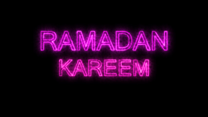 Neon sign with the words Ramadan Kareem glowing in pink on dark background.