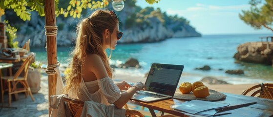 Digital nomad working peacefully on her laptop at a beach cafe, with a serene sea view behind her, embodying ultimate freedom.