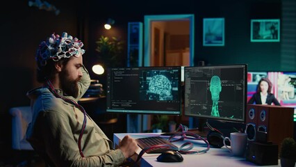 Computer engineer using EEG headset, starting mind upload process using brain machine interface. Man using neuroscientific device to transfer consciousness into cyberspace, typing code, camera B