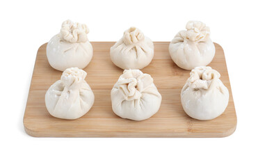Wooden board with uncooked khinkali (dumplings) isolated on white. Georgian cuisine