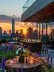 Foto op Aluminium Tables are elegantly arranged in an urban rooftop garden at sunset, with the city skyline in the distance. © Fokasu Art