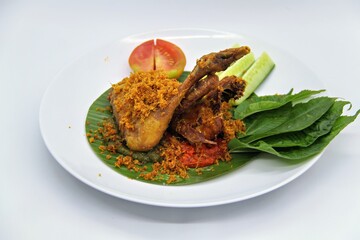 Ayam Goreng Kalasan, Indonesian food from Kalasan, Yogyakarta. It's fried chicken that cooked with special spice, combined with 'kremes', a crispy fried flour. Selective Focus