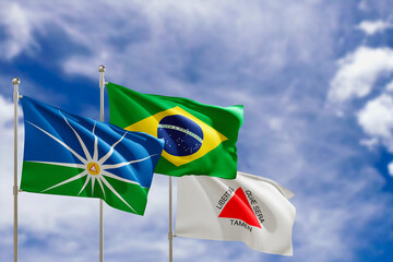 Official flags of the country Brazil, state of Minas Gerais and city of Uberlandia. Swaying in the wind under the blue sky. 3d rendering
