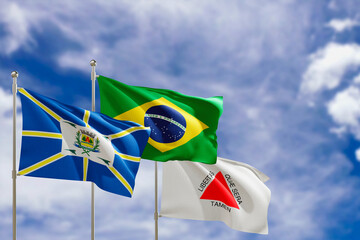 Official flags of the country Brazil, state of Minas Gerais and city of Araguari. Swaying in the wind under the blue sky. 3d rendering