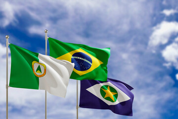 Official flags of the country Brazil, state of Mato Grosso and city of Cuiaba. Swaying in the wind under the blue sky. 3d rendering