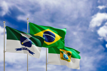 Official flags of the country Brazil, state of Rio Grande do Norte and city of Natal. Swaying in the wind under the blue sky. 3d rendering