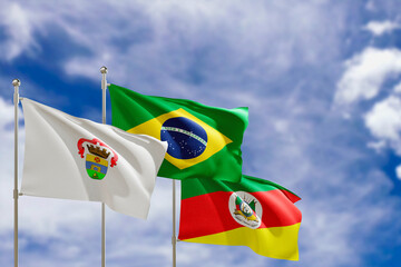 Official flags of the country Brazil, state of Rio Grande do Sul and city of Porto Alegre. Swaying in the wind under the blue sky. 3d rendering