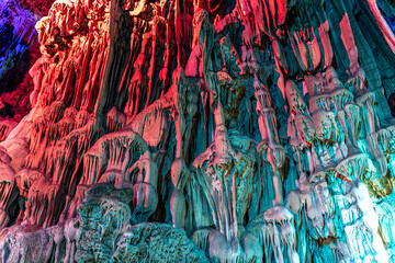 Illuminated multicolored stalactites, Reed Flute cave. Guilin Guangxi. China © Tatiana Kashko