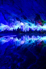 The Reed Flute Cave, natural limestone cave with multicolored lighting in Guilin
