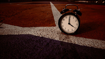 Retro alarm clock showing 4 o'clock