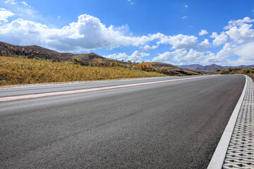 Asphalt highway road and mountain natural landscape in autumn