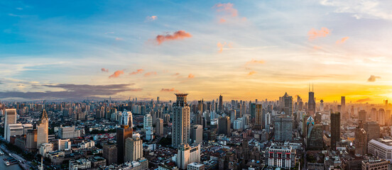 Aerial view of Shanghai city skyline and skyscrapers scenery at sunset. Famous city landmarks in Shanghai. Panoramic view.