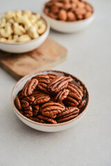 Pecan nuts, almond and cashew in bowls