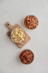Pecan nuts, almond and cashew in bowls