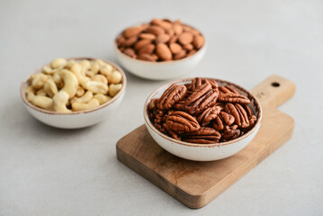 Pecan nuts, almond and cashew in bowls