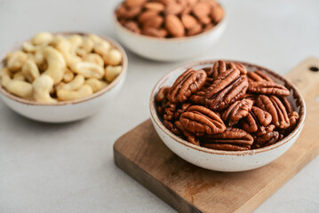 Pecan nuts, almond and cashew in bowls