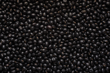 Black soybean seeds, an ingredient for making vegetarian and healthy food. Close-up image of food background texture