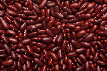 Red kidney bean seeds, an ingredient for making vegetarian and healthy food. Close-up image of food background texture