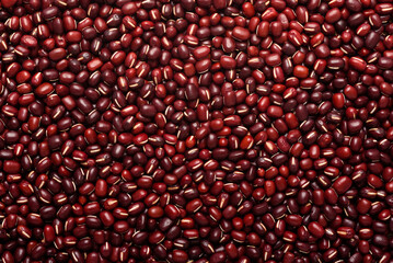 Red azuki bean seeds, an ingredient for making vegetarian and healthy food. Close-up image of food background texture