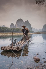 Crédence de cuisine en verre imprimé Guilin Sailing peacefully across a river, Guilin cormorant fishermen set out on river