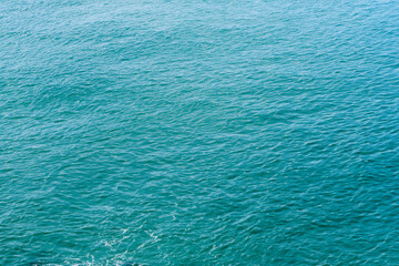 Blue sea water background. Top view of the surface of the sea.