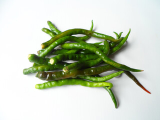 Curly green chilies or Capsicum annuum or cabai hijau keriting isolated on white background