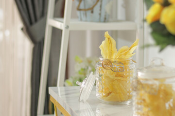 banana chips in a jar with blurred foreground and background