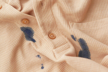  shirt with blue ink stain .