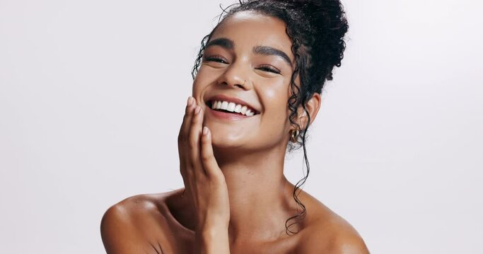 Girl, face and skincare in studio with touch for soft or smooth, glowing and skin for wellness with natural beauty. Woman, satisfaction and dermatology, cosmetics and self care on white background.