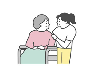 女性介護士と車椅子に乗った高齢女性